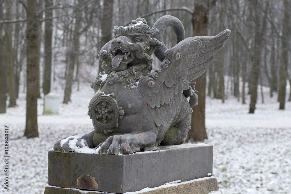 The sculpture of the dragon on the bridge closeup gloomy winter day. Tsarskoye Selo, Russia