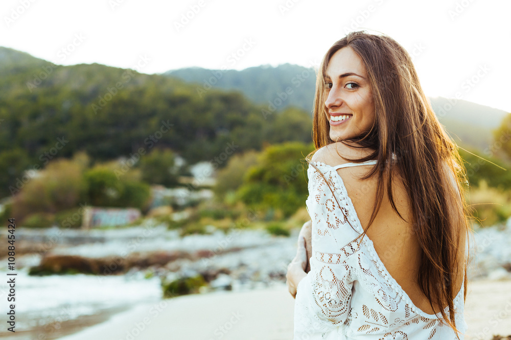 Portrait of a beautiful woman on the sand Portrait of a beautiful woman on the sand