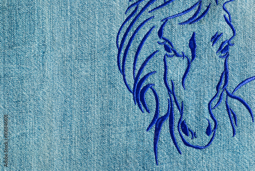 Horse head embroidery on a jeans.
