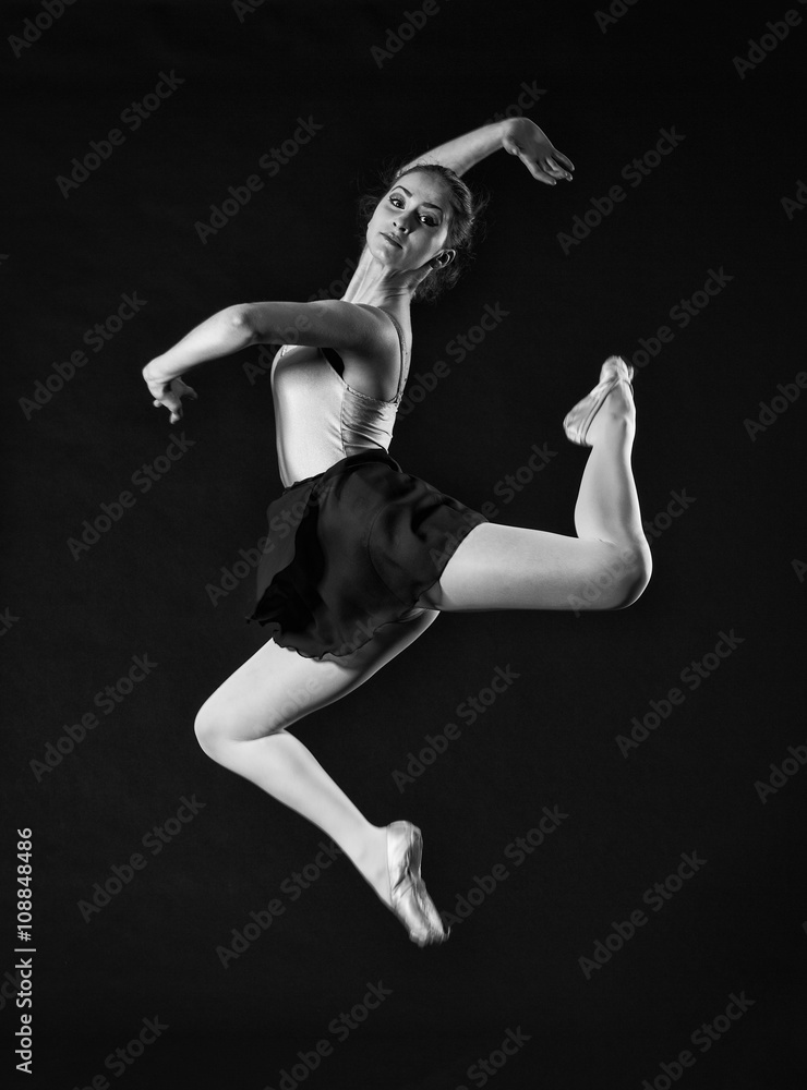 Naklejka premium Ballerina jumping . Black and white photo.