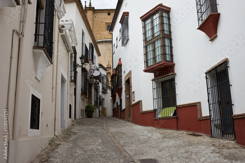 Narrow Street in Old Town of Ronda in Spain