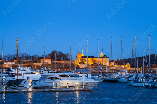 Boats in harbor of Oslo and Akershus castle