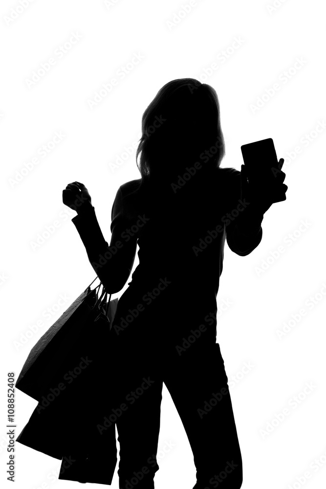 silhouette of a woman with shopping bags