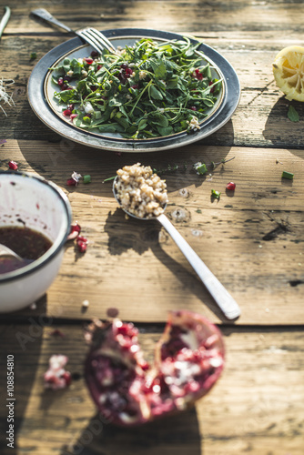 Green salad with pomegranate, manna croup, onion