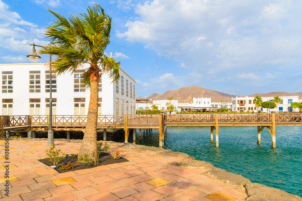 Footbridge and traditional buildings in Playa Blanca port, Lanzarote, Canary Islands, Spain