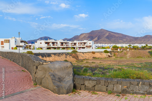 A view of typical white Canary style apartments against volcano mountain  Lanzarote  Canary Islands  Spain