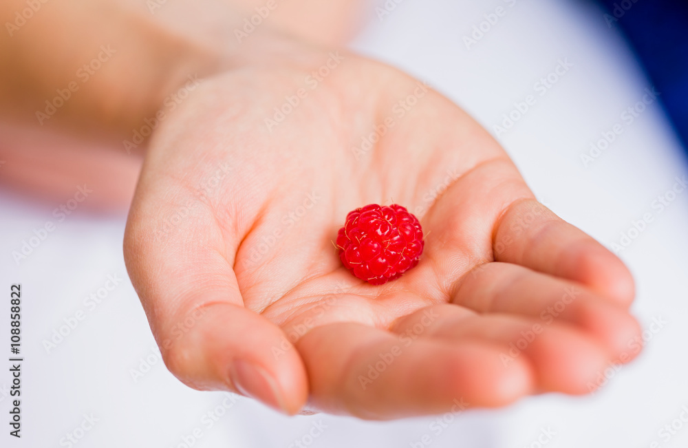 Raspberry in hand Raspberry in hand