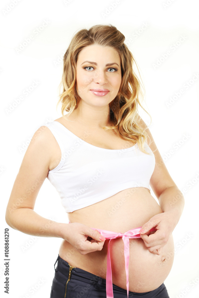 Beautiful pregnant woman with pink ribbon on white background Beautiful pregnant woman with pink ribbon on white background