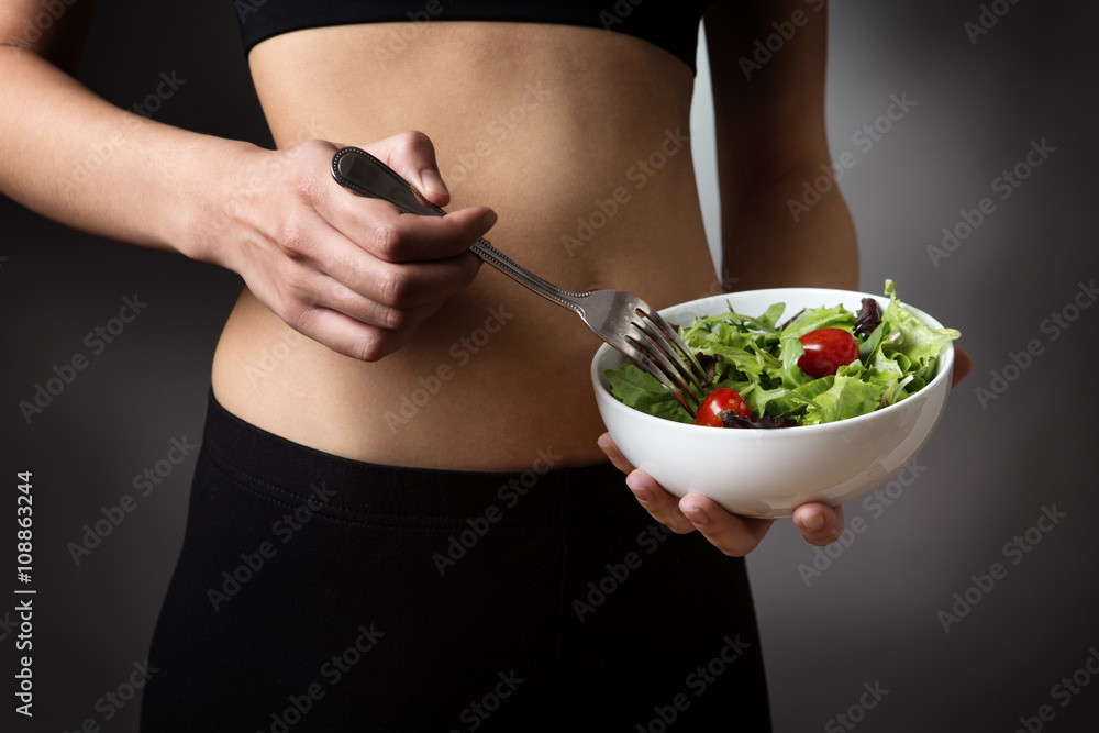 holding a bowl of salad holding a bowl of salad