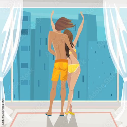 Young couple standing in their underwear in the panoramic windows and admiring the stunning views of the metropolis - Urban Lifestyle or Apartment purchase concept