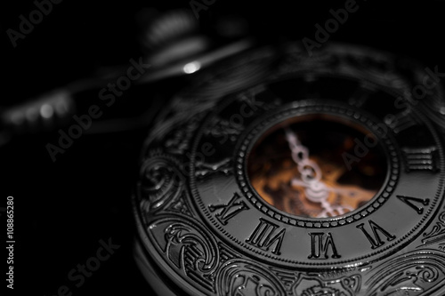 Pocket fob watch / antique pocket fob watch on black background