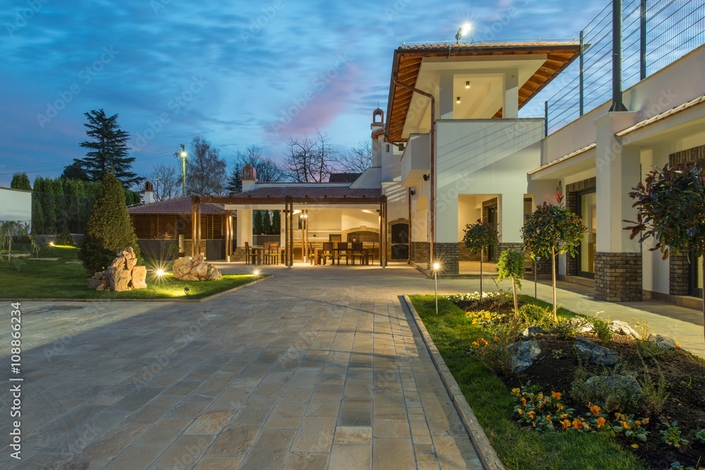 Naklejka premium Luxurious villa exterior and magic sky