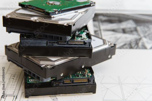 pile of  hard drives at white background