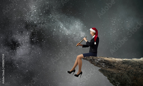 Santa woman using spyglass