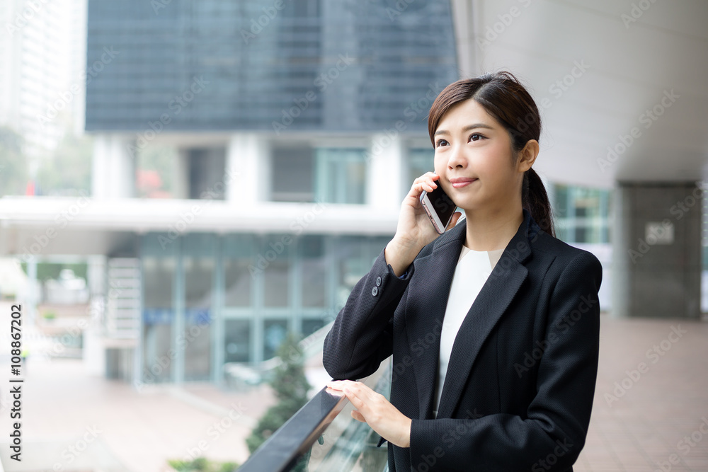Business woman talk to mobile phone Business woman talk to mobile phone