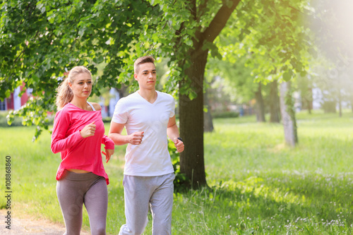 Man and woman jogging together in the park