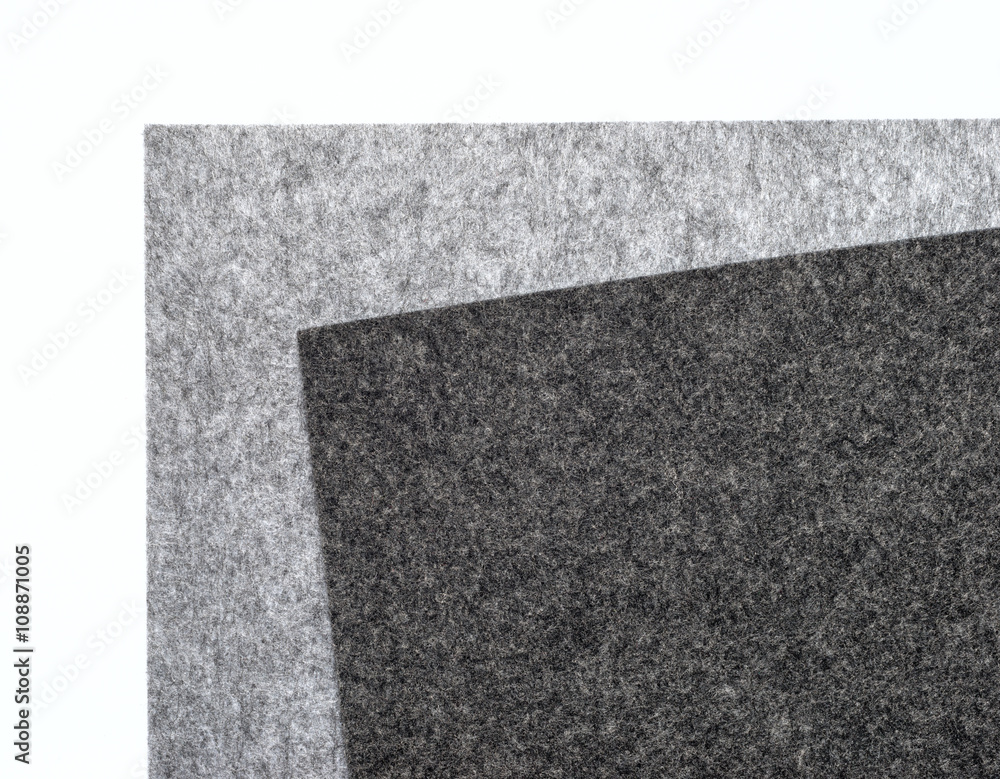 gray felt pieces on a white background.