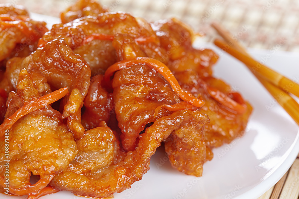 Chinese cuisine. Pork in batter and sweet and sour sauce Chinese cuisine. Pork in batter and sweet and sour sauce