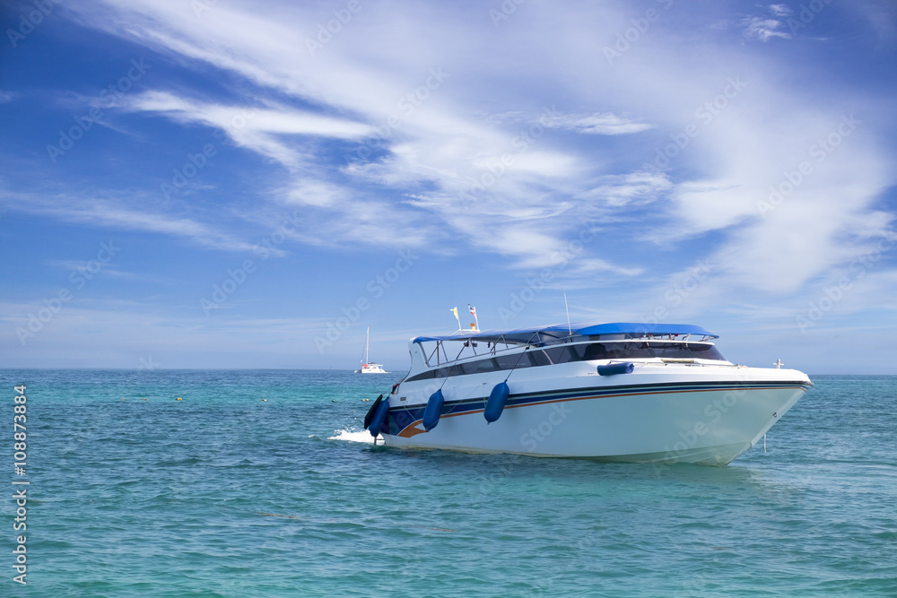 speed boat in tropical sea with blusky