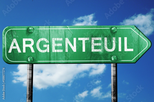 Fotografie argenteuil road sign, vintage green with clouds background