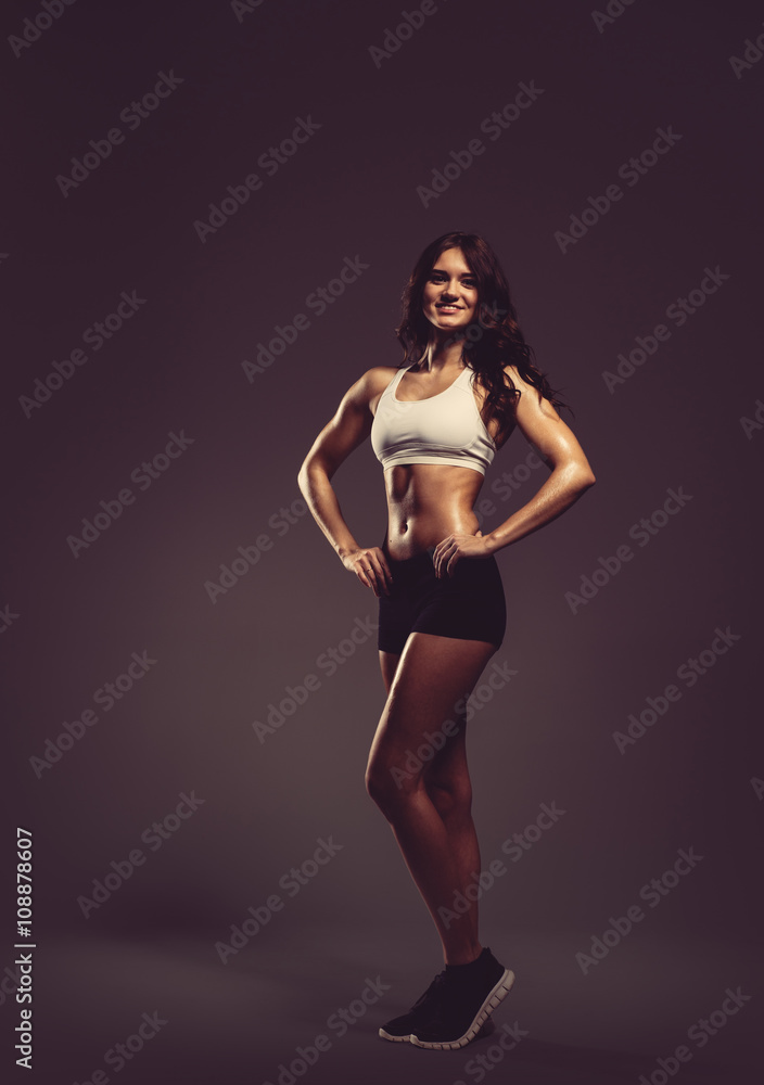 Beautiful young athletic woman, studio shot