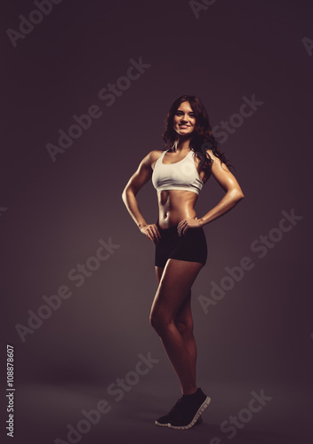 Beautiful young athletic woman, studio shot