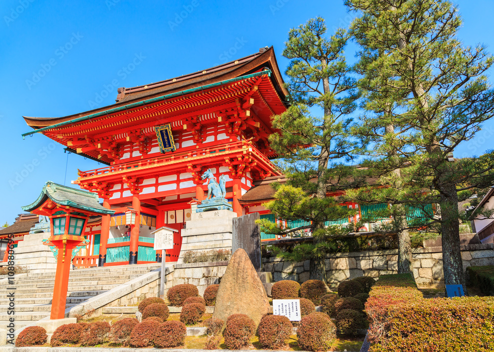 Fototapeta premium Ancient japanese wood gate and garden with blue sky, Kyoto, Japan
