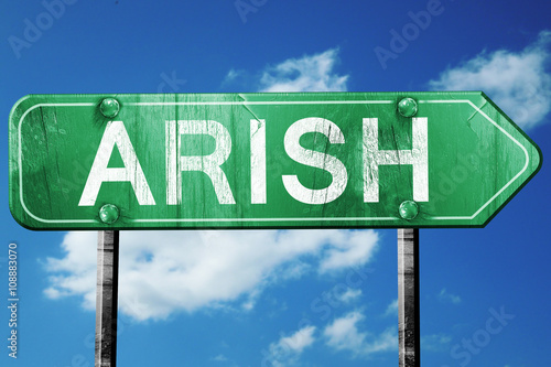 arish road sign, vintage green with clouds background