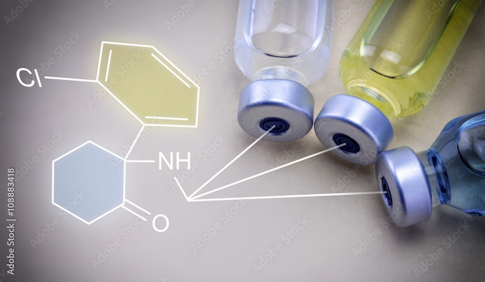 Medicine vials and Chemical formula isolated on brown background Medicine vials and Chemical formula isolated on brown background