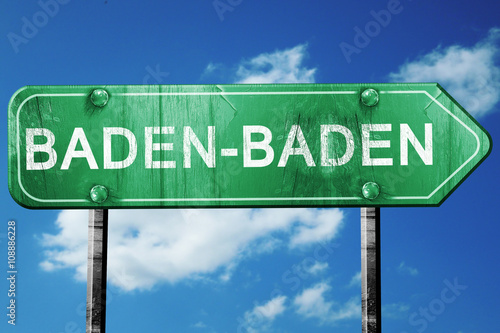 Baden-baden road sign, vintage green with clouds background © Argus