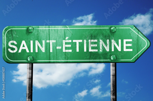 saint-etienne road sign, vintage green with clouds background © Argus