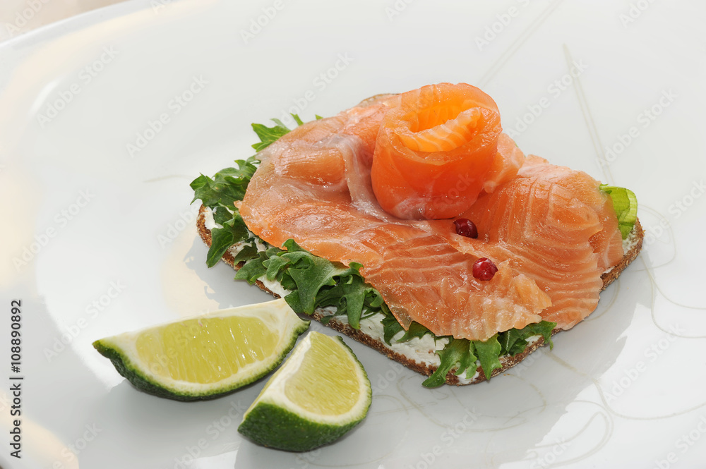 sandwiches of salmon with salad leaves