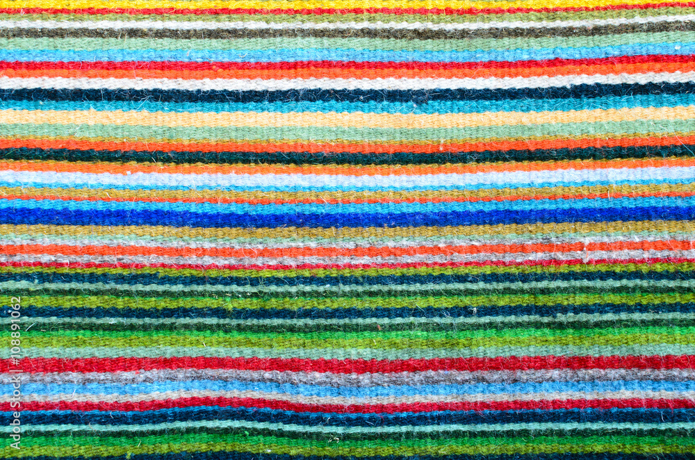 Pattern of colorful stripes - closeup of a woven carpet Pattern of colorful stripes - closeup of a woven carpet