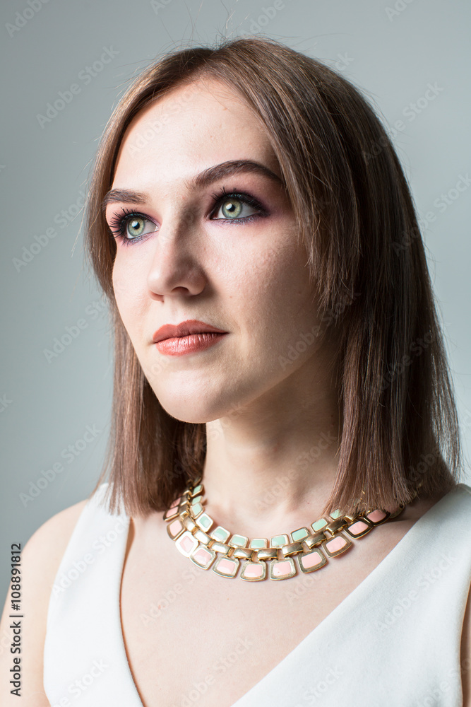 Portrait of young beautiful woman with middle length hair and smoky eyes make-up Portrait of young beautiful woman with middle length hair and smoky eyes make-up