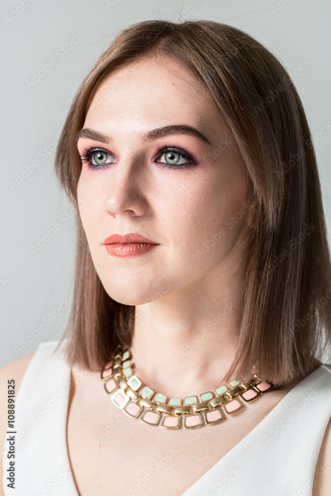 Portrait of young beautiful woman with middle length hair and smoky eyes make-up Portrait of young beautiful woman with middle length hair and smoky eyes make-up