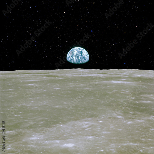 Fototapeta Naklejka Na Ścianę i Meble -  Moon surface with Earth view. Elements of this image furnished by NASA