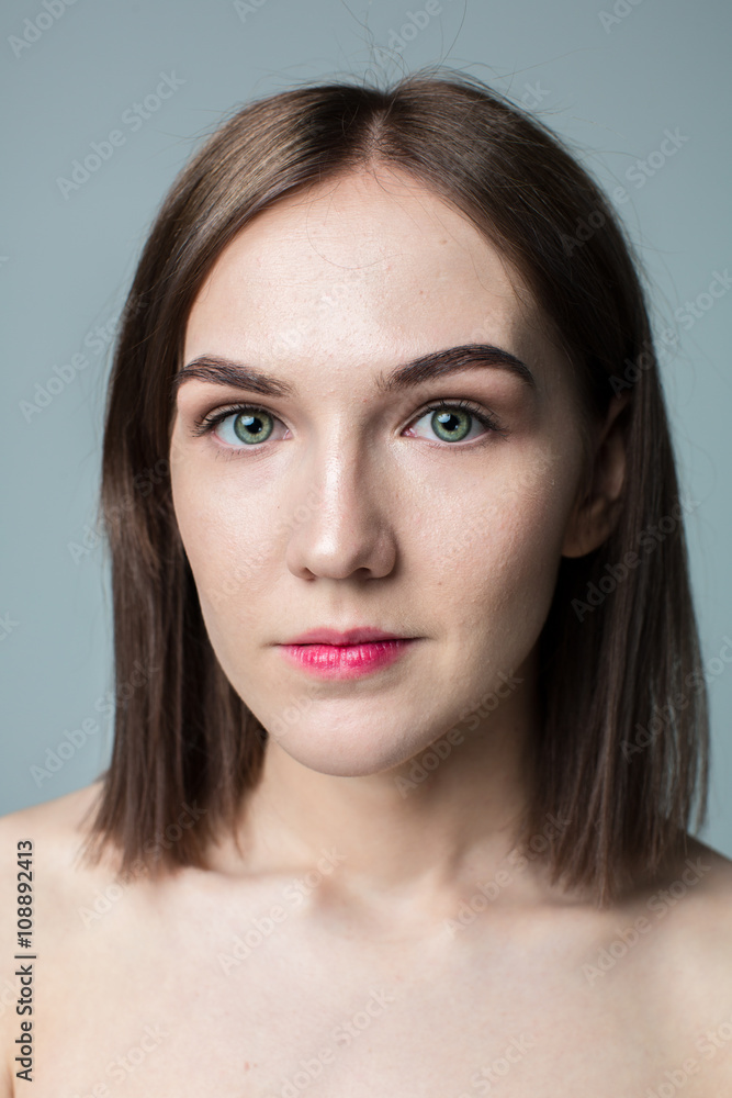 Beauty portrait of young model with middle length hair. Professional nude makeup. Green eyes. Beauty portrait of young model with middle length hair. Professional nude makeup. Green eyes.