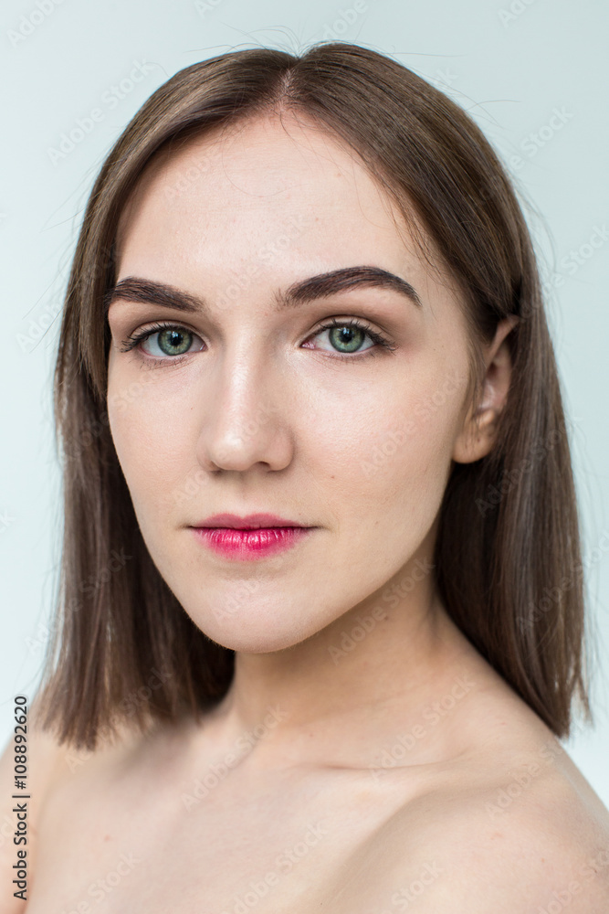 Beauty portrait of young model with middle length hair. Professional nude makeup. Green eyes. Beauty portrait of young model with middle length hair. Professional nude makeup. Green eyes.