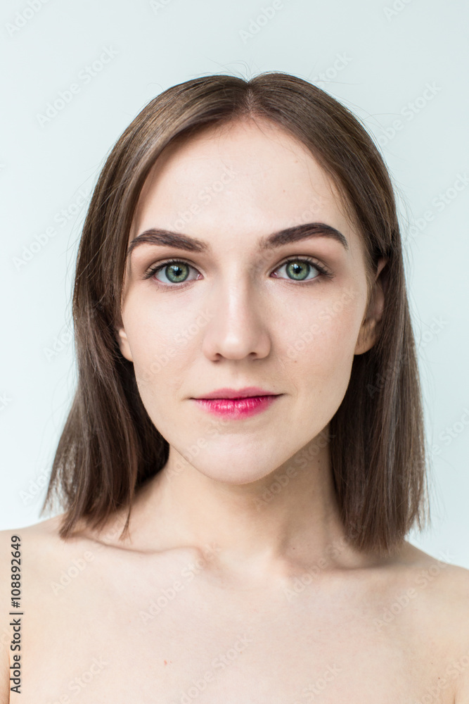 Obraz premium Beauty portrait of young model with middle length hair. Professional nude makeup. Green eyes.