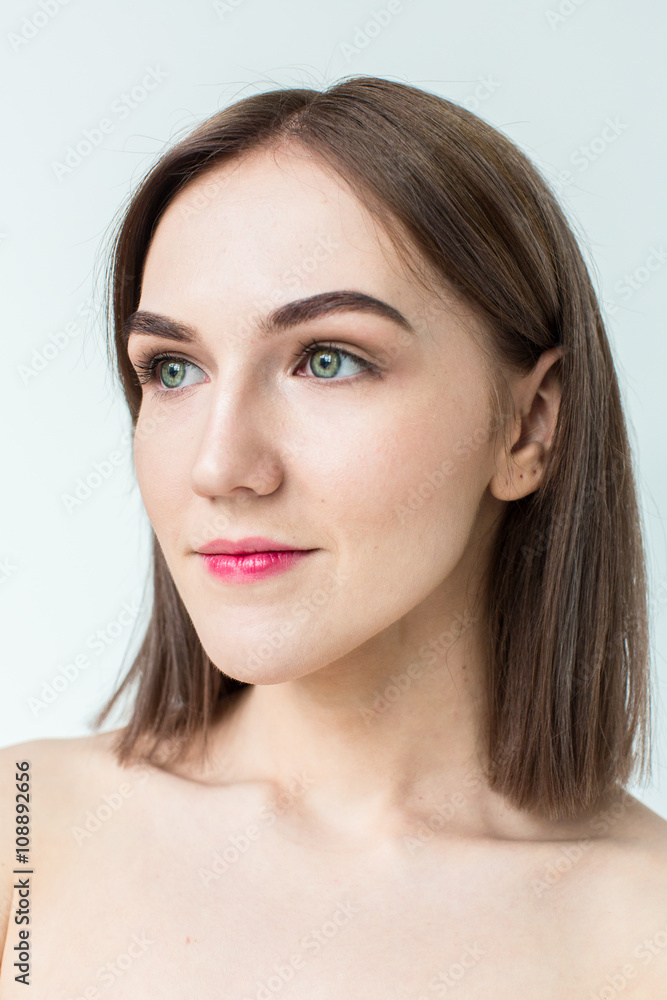 Beauty portrait of young model with middle length hair. Professional nude makeup. Green eyes. Beauty portrait of young model with middle length hair. Professional nude makeup. Green eyes.
