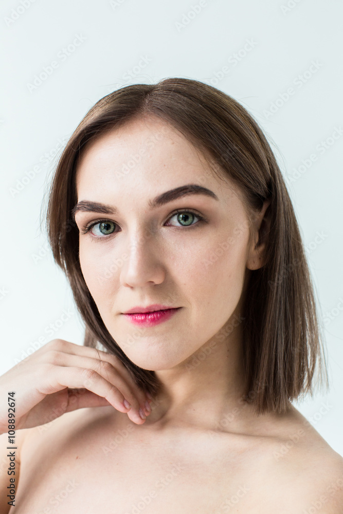 Fototapeta premium Beauty portrait of young model with middle length hair. Professional nude makeup. Green eyes.