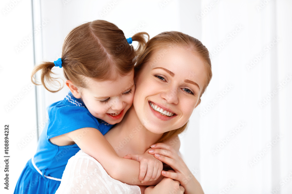Happy loving family. mother and child laughing and hugging Happy loving family. mother and child laughing and hugging