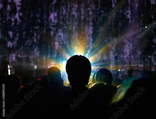 Man in crowd with glowing head