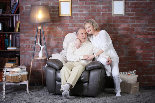 Mature couple sitting toget...