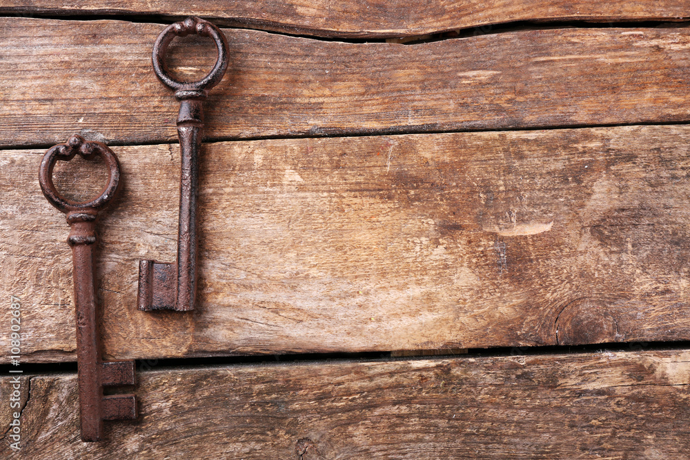 Old keys on wooden background, copy space Old keys on wooden background, copy space