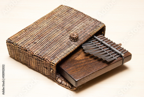 Traditional African instrument kalimba or thumb piano in a wicker case