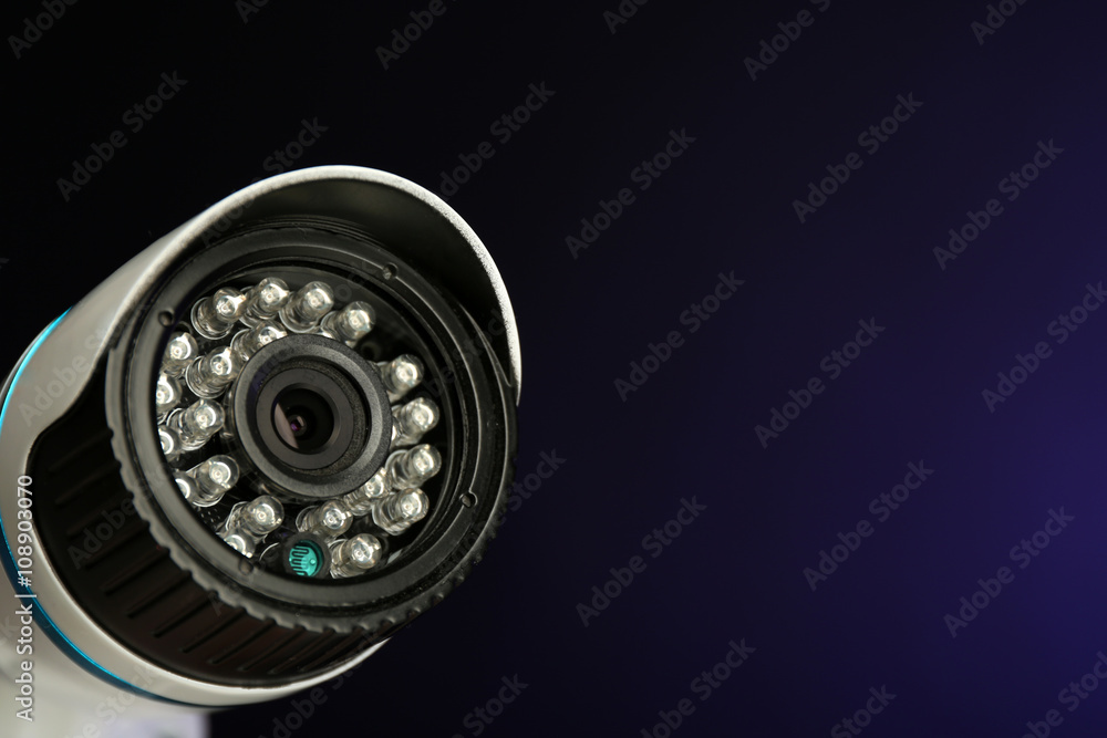 Security CCTV camera on blue background, closeup Security CCTV camera on blue background, closeup