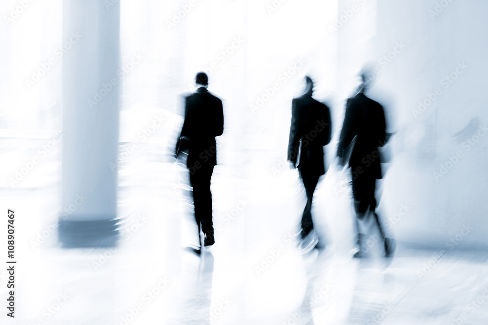 group of people in the lobby business center and blue tonality group of people in the lobby business center and blue tonality