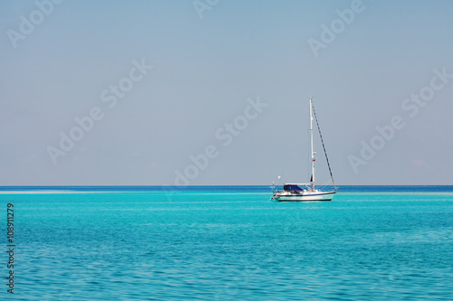 white speedboat yacht in blue ocean