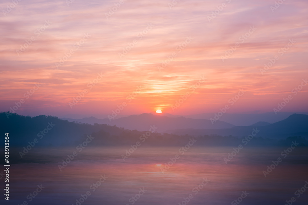 Colorful sunset on top of thailand mountain and lagoon. Vintage